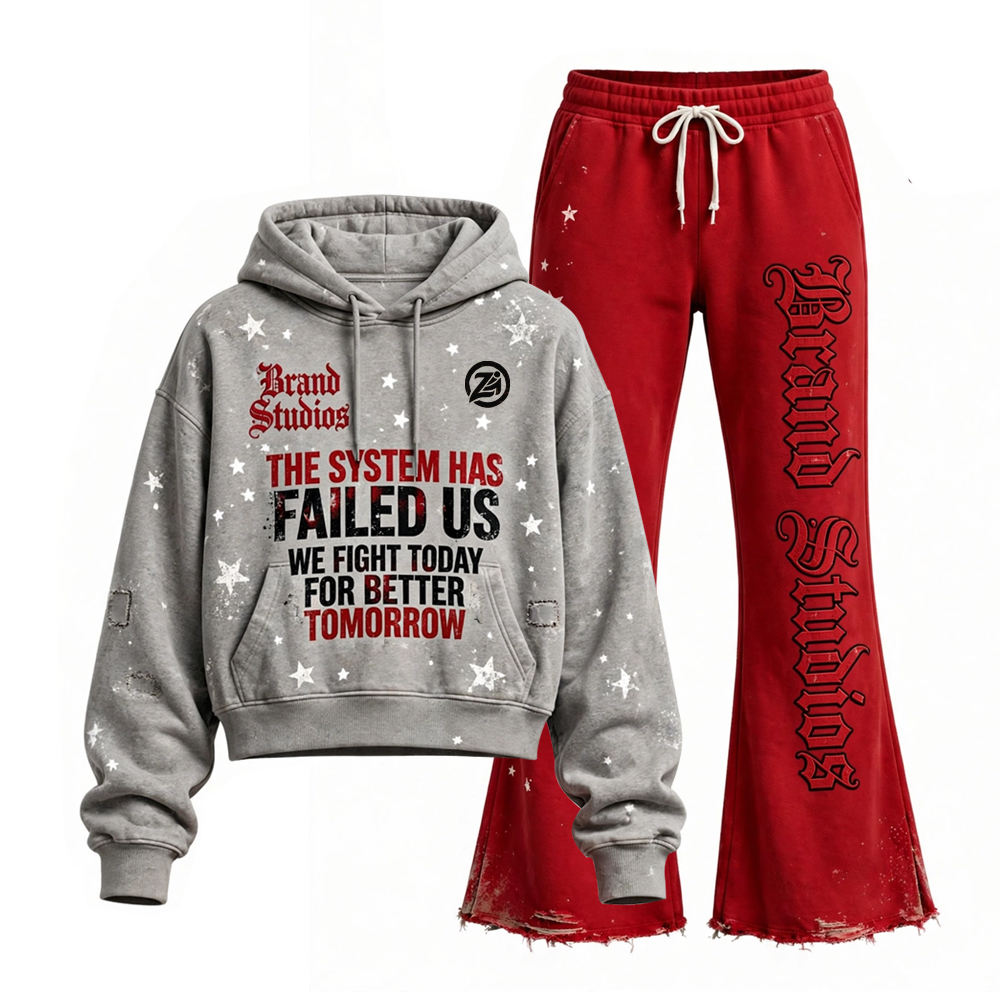 Grey and red graphic tracksuit set featuring a white star-print pullover hoodie with bold statement lettering and red flared sweatpants with gothic-style leg graphics and distressed hems, displayed on a white background.