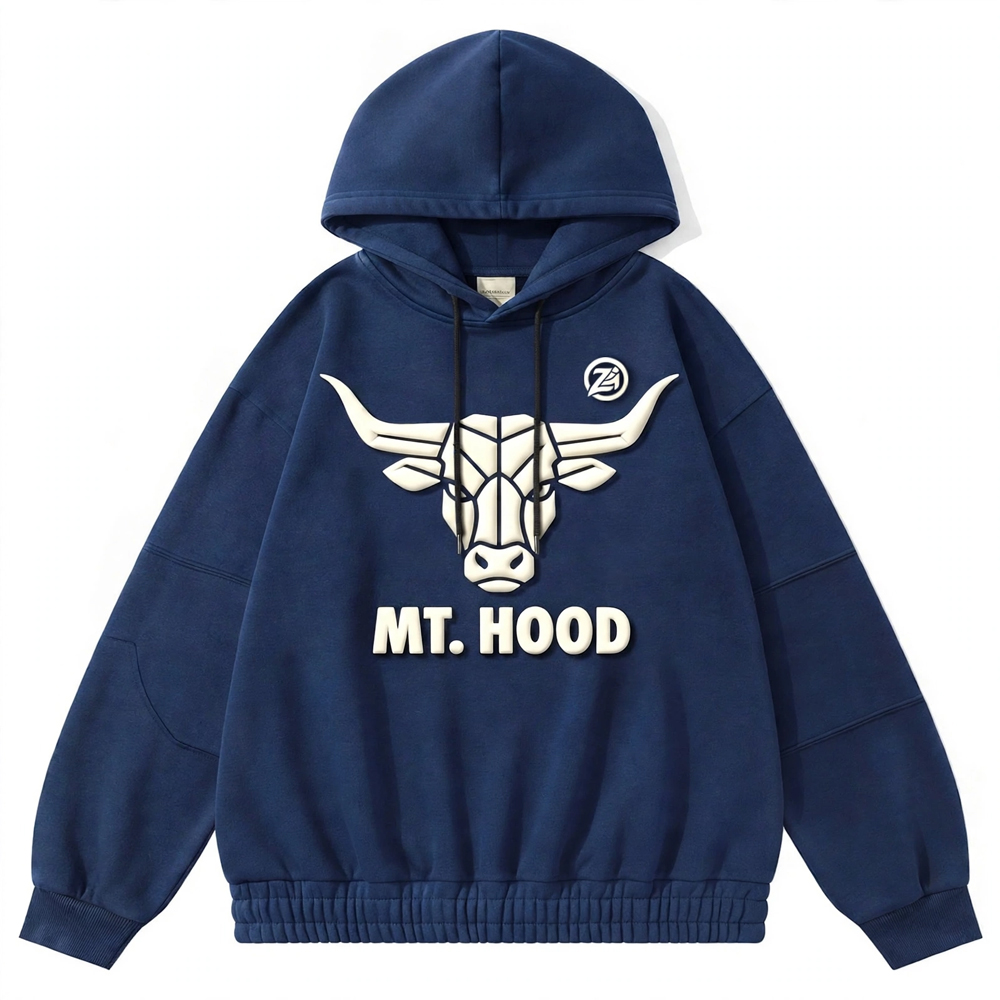 Navy blue graphic pullover hoodie featuring a bold white bull head design, front lettering, adjustable hood drawstrings, ribbed cuffs, and gathered hem on a white background.